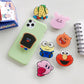 Cartoon Phone Socket. Griptok. Attach it to your phone so you can hold it securely, prop it up whilst watching shows, or just fiddle around with it. Compatible with any phone!
