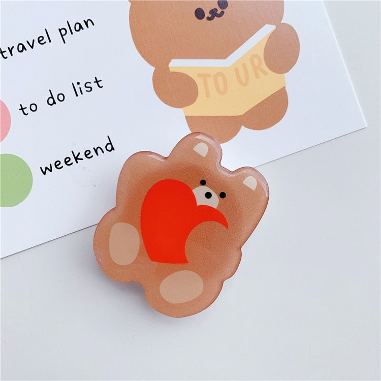 Cartoon Bear Phone Socket. Attach these to your phone so you can hold it securely, prop it up whilst watching shows, or just fiddle around with it.  Compatible with any phone!