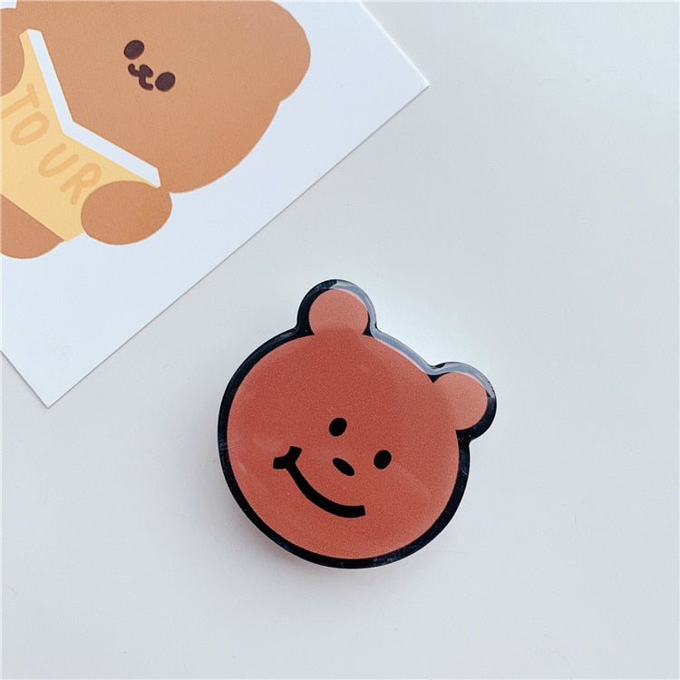 Cartoon Bear Phone Socket. Attach these to your phone so you can hold it securely, prop it up whilst watching shows, or just fiddle around with it.  Compatible with any phone!