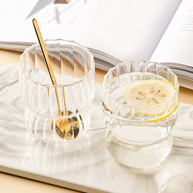 Curvy glass cup with vertical stripes, perfect size for your hands with a non-slip design, stackable shape. Heat resistant glass material too! 