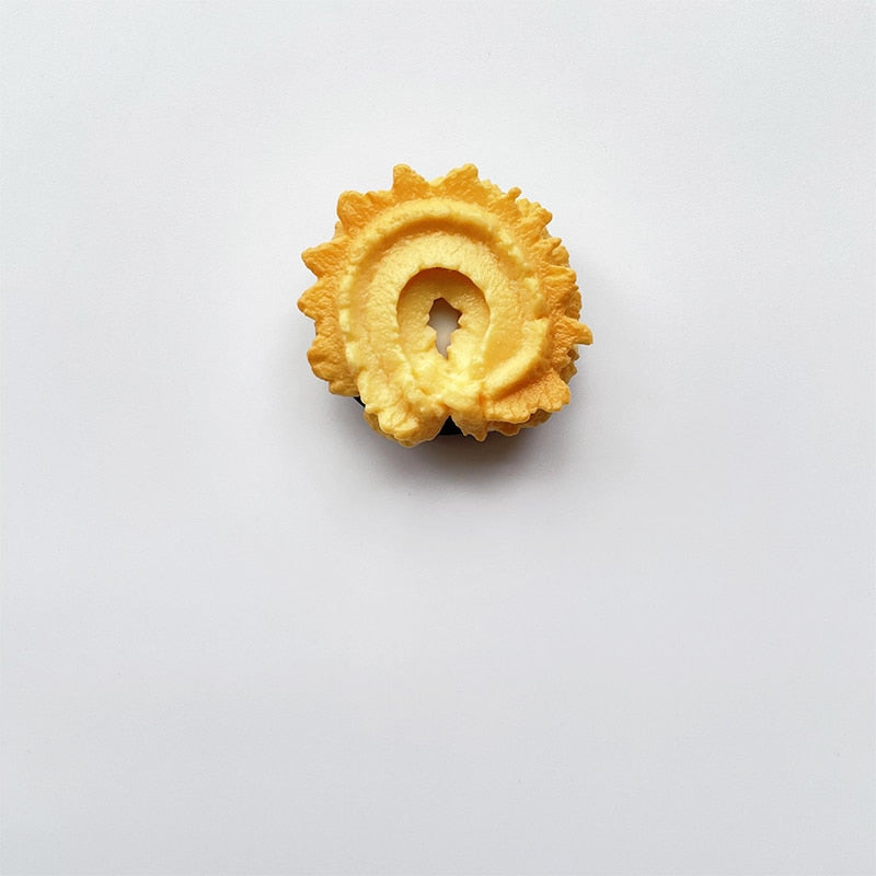 Phone Socket Danish Butter Cookies. Griptok. Attach it to your phone so you can hold it securely, prop it up whilst watching shows, or just fiddle around with it. Compatible with any phone!