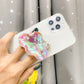 Holographic Clouds Phone Socket. Attach these to your phone so you can hold it securely, prop it up whilst watching shows, or just fiddle around with it.  Compatible with any phone!